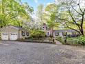 Charming brick home with a well-manicured front yard, mature trees, and an inviting curb appeal at 3232 Kale Ln, Matthews, NC 28105