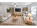 Bright living room featuring stylish furnishings, hardwood floors, and large windows at 3357 Ellingford Rd, Charlotte, NC 28214