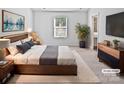 Comfortable main bedroom featuring a serene decor, soft lighting, and attached bath at 3357 Ellingford Rd, Charlotte, NC 28214