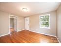 Bright living room with hardwood floors, a large window, and neutral paint at 390 15Th Ne Ave, Hickory, NC 28601