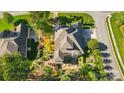 Sprawling home with landscaped backyard featuring mature trees and an outdoor patio at 404 Brookridge Dr, Mount Holly, NC 28120