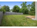 Fenced backyard with a wooden deck, offering privacy and space for outdoor activities at 4219 Shasta Cir, Clover, SC 29710