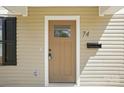 Elegant front door with sidelights, enhancing curb appeal and inviting entry to the home at 74 Snyder Ne Ct, Concord, NC 28025