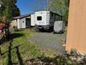 Back exterior view of the RV showing storage and a bicycle at 103 Hidaway Trl # 99A, Mount Gilead, NC 27306