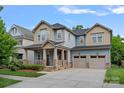 Inviting two-story home with a covered front porch and two-car garage, perfect for a growing Gathering at 10423 Drake Hill Dr, Huntersville, NC 28078