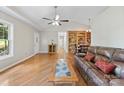Inviting living room featuring hardwood floors, a vaulted ceiling, and ample natural light creates a warm atmosphere at 109 Wren Ln, Mooresville, NC 28117
