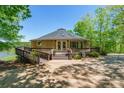 Unique round home featuring a wraparound deck perfect for enjoying serene natural surroundings at 1308 Twin Oaks Dr, Chester, SC 29706