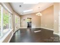 Spacious living room featuring gleaming hardwood floors, skylights, and ample natural light at 1308 Twin Oaks Dr, Chester, SC 29706