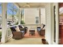Relaxing front porch with comfortable seating, creating a welcoming outdoor living space at 140 Parkview St, Davidson, NC 28036