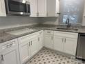 Kitchen featuring white cabinets, stainless steel appliances and granite countertops at 1401 Anderson St, Charlotte, NC 28205