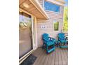 Home's porch featuring comfortable blue chairs perfect for relaxing outdoors at 14522 Waterside Dr, Charlotte, NC 28278