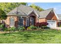 Charming brick home with a well-manicured lawn and landscape, plus an attached two-car garage at 1511 Elkhart Cir, Gaston, NC 28054