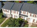 Aerial shot showcasing a well-maintained townhome complex with neat landscaping and gray roofs at 158 Water Oak Dr, Pineville, NC 28134
