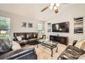 Spacious living room with a large flat-screen TV, comfortable seating, and lots of natural light at 1807 Oakdale Green Dr, Charlotte, NC 28216