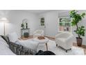 Bright living room with neutral decor, showing stylish furniture, wood-look flooring, and natural light at 261 8Th Avenue Se Dr, Hickory, NC 28602