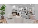 Bright and airy living room with modern decor, featuring an open-concept kitchen and dining area at 261 8Th Avenue Se Dr, Hickory, NC 28602