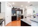 Modern kitchen featuring granite countertops, stainless steel appliances, and dark cabinetry at 3246 Yarmouth Ln, Gastonia, NC 28056