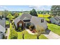 Stunning aerial view of the home with beautiful landscaping and a scenic countryside backdrop at 4705 Granite Ct, Indian Trail, NC 28079