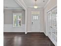 Elegant foyer with hardwood floors, white trim, and ample natural light at 708 Brookmeade Dr, Waxhaw, NC 28173