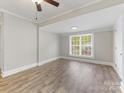 Bright bedroom featuring hardwood floors and a large window at 721 Broad St, Kannapolis, NC 28081