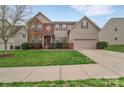 Inviting two-story home with a well-manicured lawn, complemented by tasteful landscaping and a welcoming entrance at 7362 Waterwheel Sw St # 280, Concord, NC 28025
