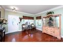 Inviting foyer with hardwood floors, decorative doorway, and an elegant display cabinet at 739 Ivy Trail Way, Fort Mill, SC 29715