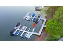 Aerial view featuring covered boat slips at a private residence, offering convenient water access at 8271 Camelia Ln, Denver, NC 28037