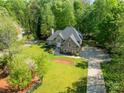 Beautiful home with well-manicured lawn, mature trees, and a long driveway at 108 Tall Oak Dr, Mooresville, NC 28117