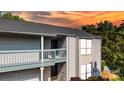 Charming condo featuring a balcony, light siding, and a newly installed roof at 11163 Harrowfield Rd # 8198, Charlotte, NC 28226
