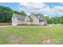 Spacious home exterior with a detached garage and ample yard space at 1228 Quiet Acres Rd, Rock Hill, SC 29732