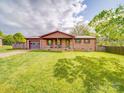 Inviting brick home featuring a covered front porch and a well-maintained lawn at 1315 Holshouser Rd, Rockwell, NC 28138