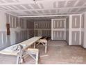 Unfinished basement with drywall, showing ample potential for customization and finishing touches at 13304 Chopin Ridge Dr, Huntersville, NC 28078
