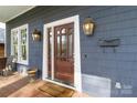 Elegant front door with sidelights, decorative lighting, and a welcoming entrance to the home at 1921 Brandon Cir, Charlotte, NC 28211