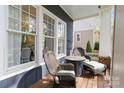 Cozy porch area with wicker furniture, offering a relaxing outdoor space for enjoying the surroundings at 1921 Brandon Cir, Charlotte, NC 28211
