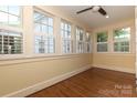 Sun-drenched room with hardwood floors and lots of windows at 2015 Dilworth E Rd, Charlotte, NC 28203