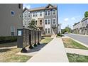 Street view of a townhome showcasing a neat exterior and convenient mailbox access at 5005 Sovereignty Ct, Charlotte, NC 28205