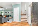 Inviting foyer with hardwood floors and staircase leading to the upper level at 8013 Sheckler Ln, Matthews, NC 28104