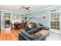 Bright and airy living room and dining area with hardwood floors and neutral paint at 8013 Sheckler Ln, Matthews, NC 28104