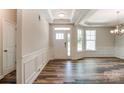 Bright foyer featuring a glass-paneled door, tray ceiling, and wood flooring at Tbd Boomer Ct # 11, Statesville, NC 28677