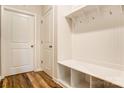 Convenient mudroom with built-in bench and storage, next to a set of doors, and wood-look floors at Tbd Boomer Ct # 11, Statesville, NC 28677