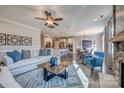 Open-concept living area featuring hardwood floors, a stone fireplace, and a view into the kitchen at Tbd Boomer Ct # 12, Statesville, NC 28677
