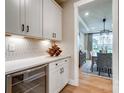 Butler's pantry featuring white cabinets, a wine rack, and an under-counter refrigerator at Tbd Boomer Ct # 14, Statesville, NC 28677