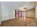 Inviting living room featuring hardwood floors, natural light, and a classic ceiling fan at 1060 Sierra Rd, York, SC 29745