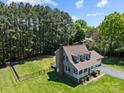 Home featuring a sprawling lawn, deck, fenced-in yard and an attached two-car garage at 1228 Swift Rd, Oakboro, NC 28129