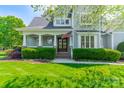 Inviting home entrance with a covered porch and manicured landscaping at 125 Swayne Dr, Mooresville, NC 28117