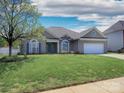 Charming single-story home with landscaped lawn, blue shutters, and attached garage at 126 Dairy Farm Rd, Mooresville, NC 28115