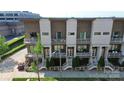 Modern townhome exteriors with multiple balconies, street view, attractive landscaping, and appealing design at 1416 S Church St, Charlotte, NC 28203
