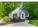 Charming home boasts a neatly landscaped front yard and a walkway leading to the inviting front entrance at 2646 Jacobs Rd, Gastonia, NC 28054