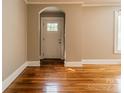 Spacious living room features gleaming hardwood floors, neutral walls, arched doorway and natural light at 2646 Jacobs Rd, Gastonia, NC 28054