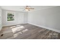 Bright bedroom with modern flooring, fresh paint and a large window at 2679 Providence Mill Rd, Maiden, NC 28650